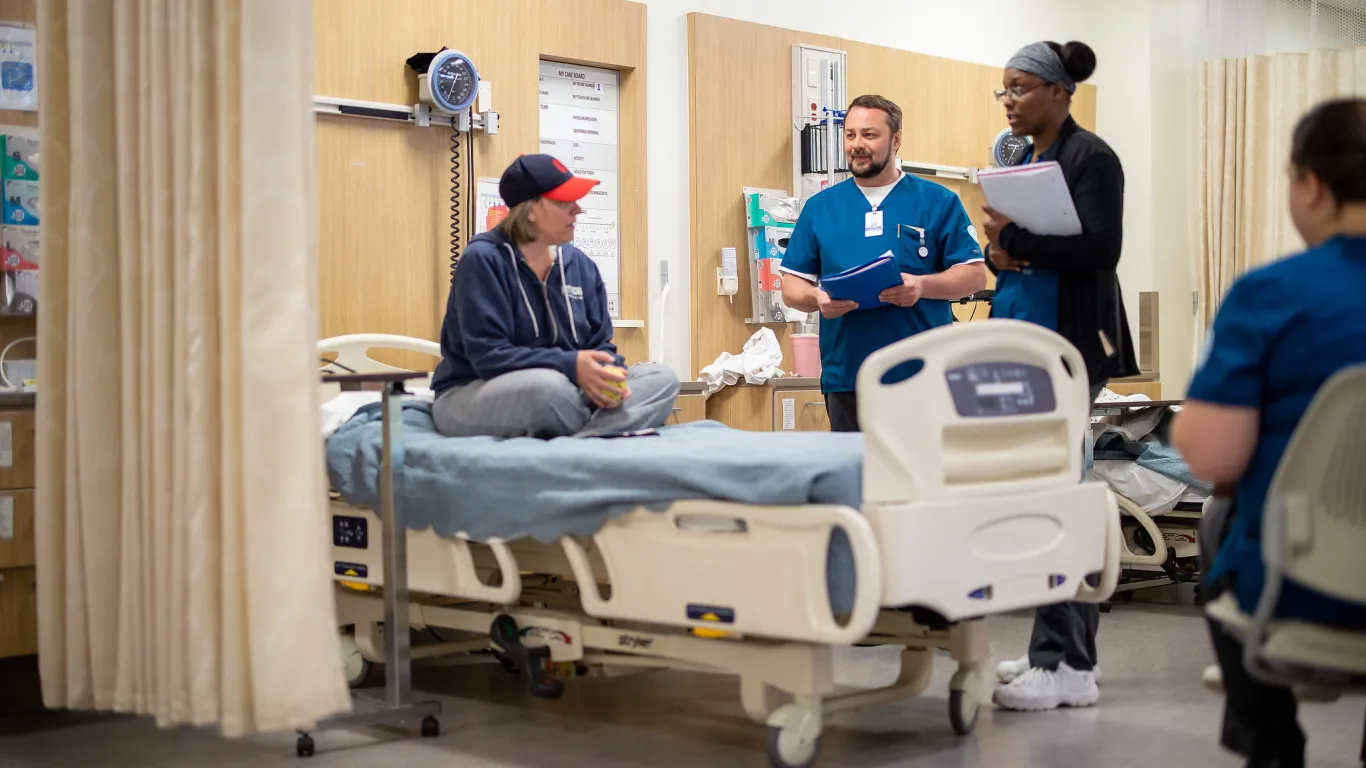 students in nursing lab with instructor 