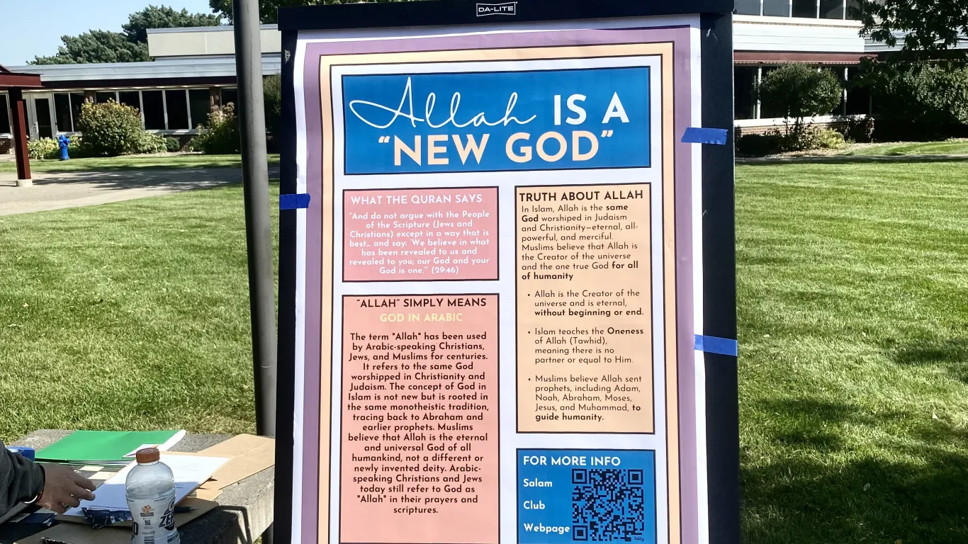 a poster on a stand outside 