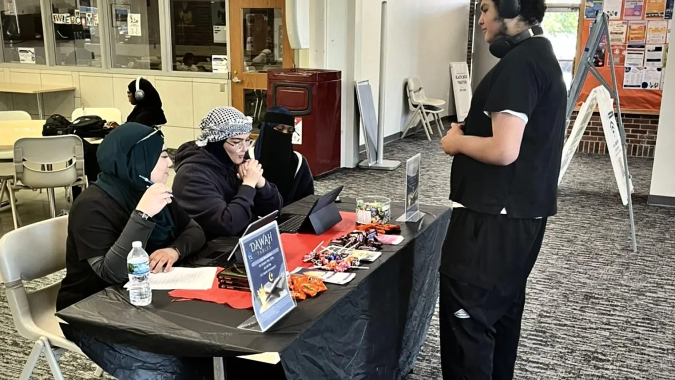 students talking at a table 