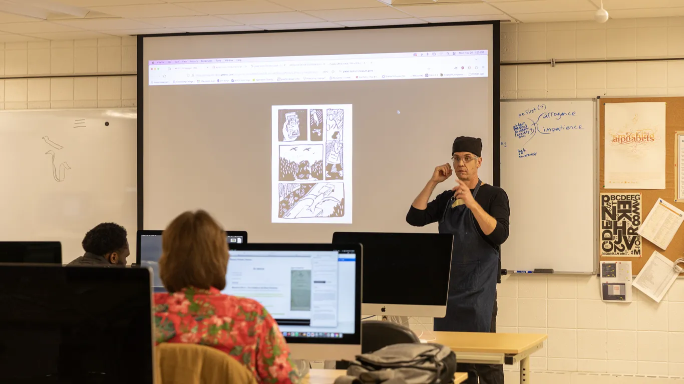 instructor talking to students in a classroom 