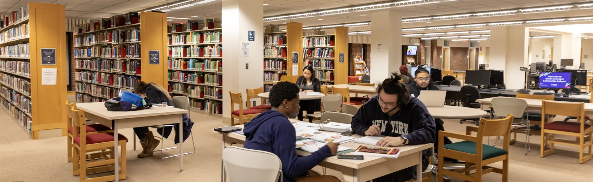 students at tables studying 