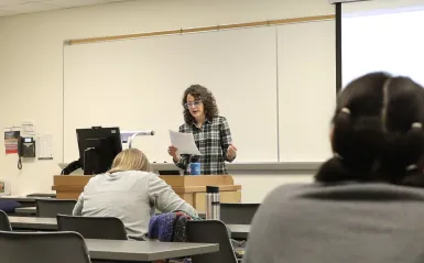 a photo of NHCC faculty, Kara Olson teaching a poetry class