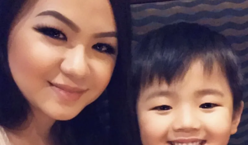 STEM Student Mee La Khang posing for a selfie with her son