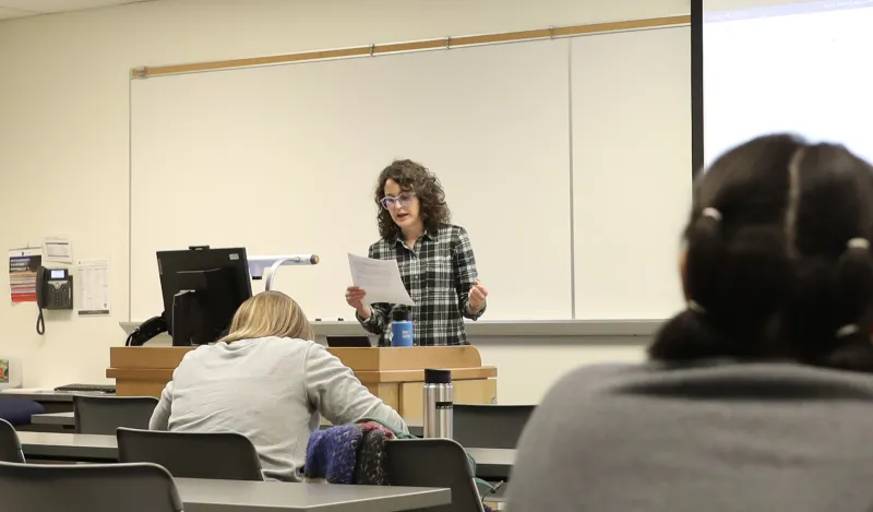 a photo of NHCC faculty, Kara Olson teaching a poetry class