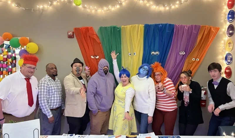 a photo of the CARE Center staff at NHCC dressed for Halloween as characters from the Pixel Inside Out 2 movie. 