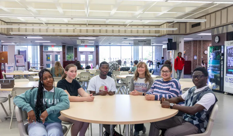 Group sitting at a table in a lunchroom