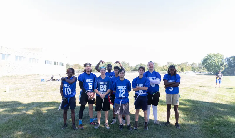 flag football group on the field with washed out background