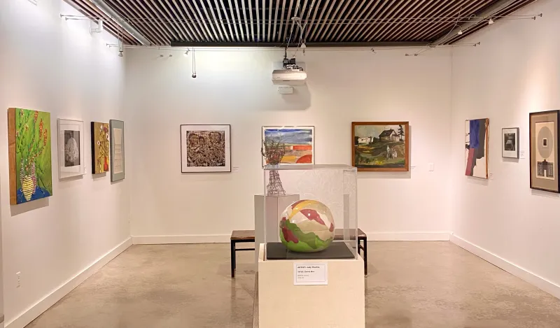 a photo of various styles of artwork on display in the gallery. 