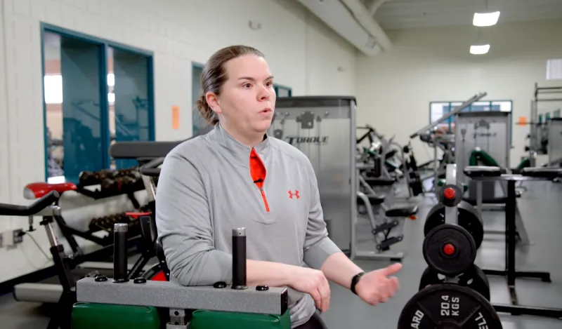 woman speaking in a gym