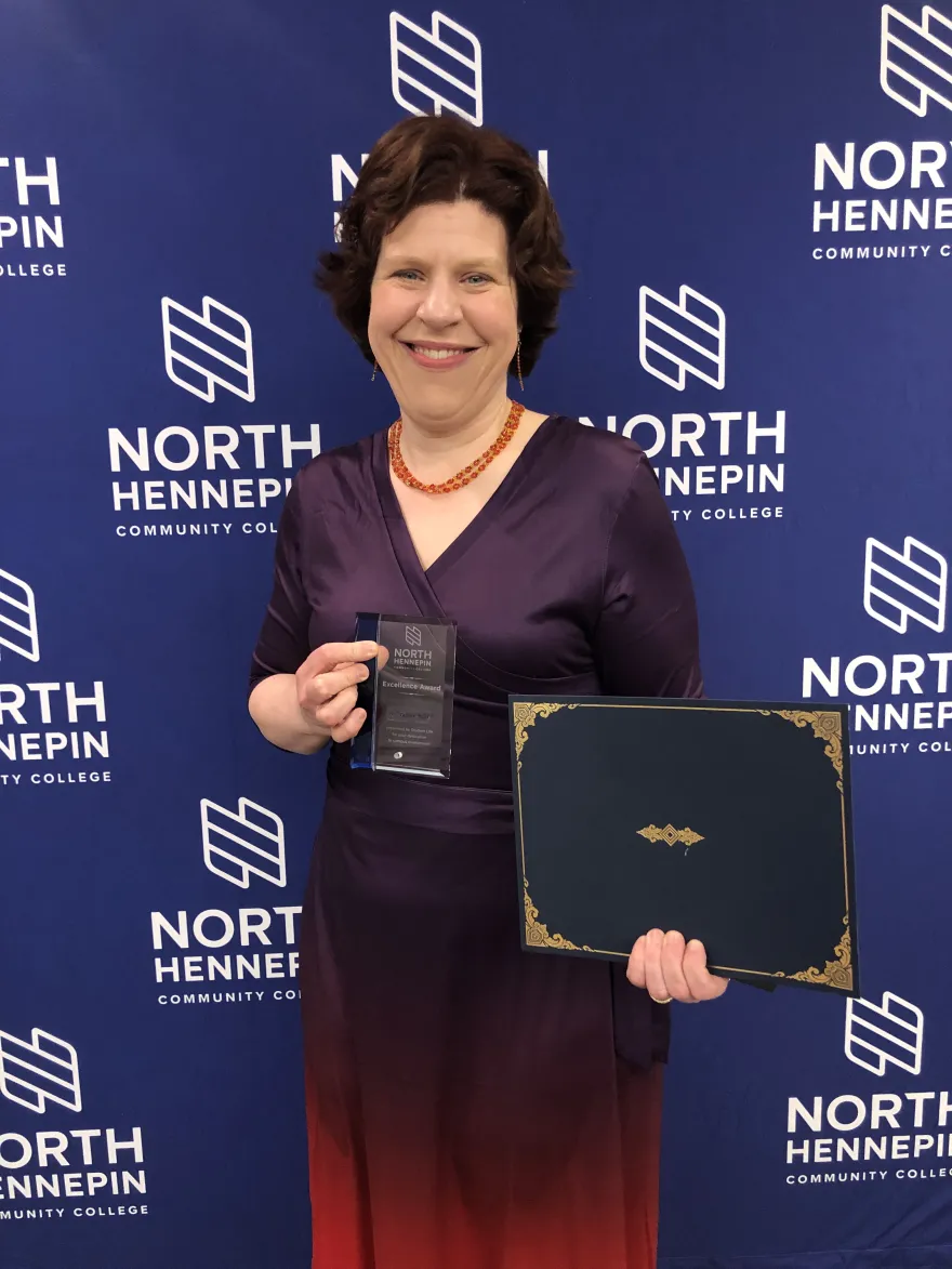 A photo of NHCC faculty, Dr. Tam Mans with her award