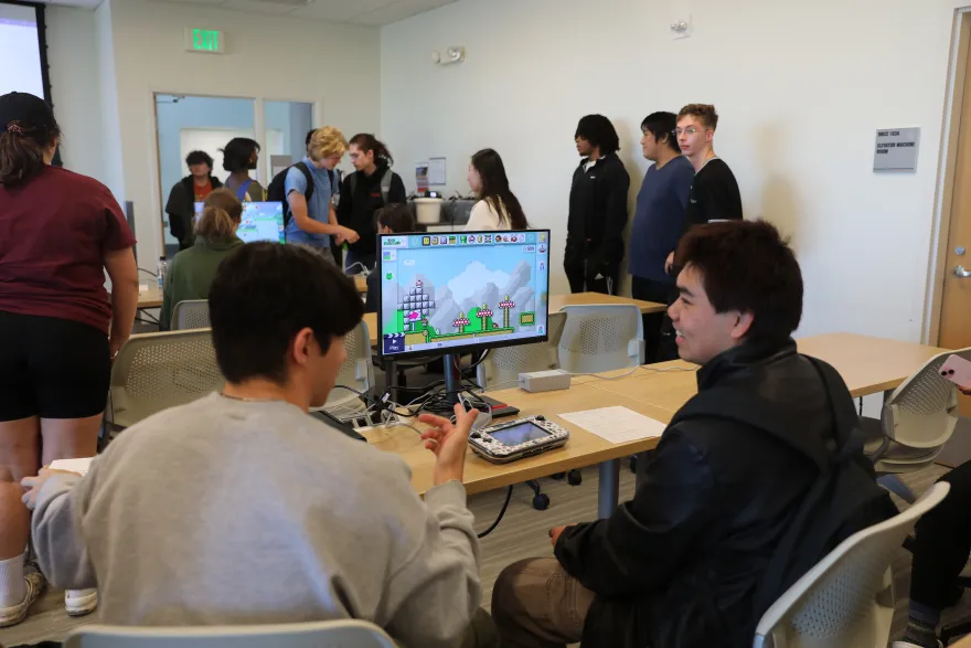 a photo of students playing video games