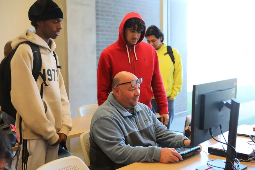 a photo of President Garcia playing video games