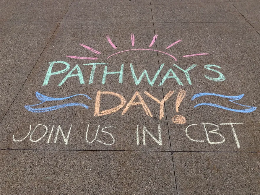 a photo of a chalk art design on the sidewalk for Pathways Day