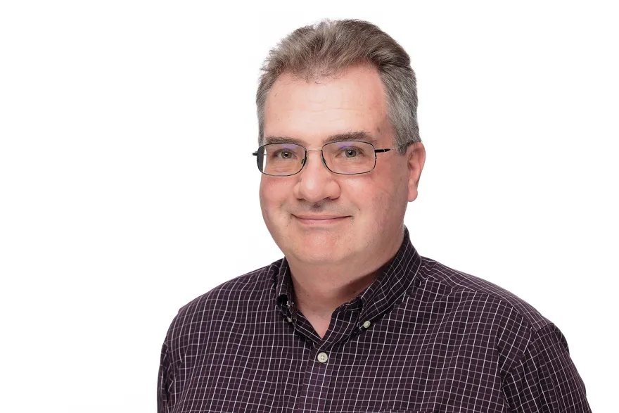 a photo of NHCC Librarian, Craig Larson, smiling at the camera. 