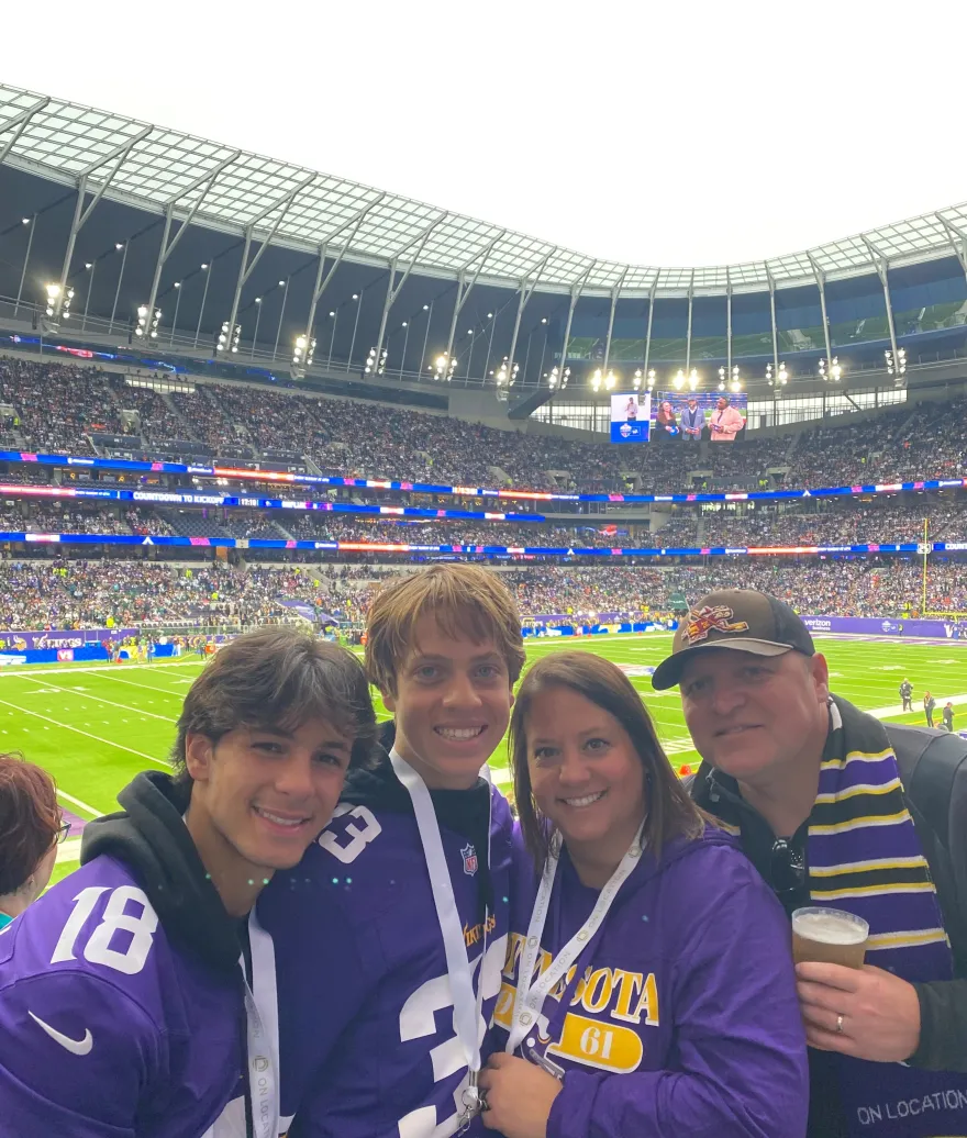 a photo of Melissa and her three family members, before the Vikings game at Tottenham Stadium in London, England. 