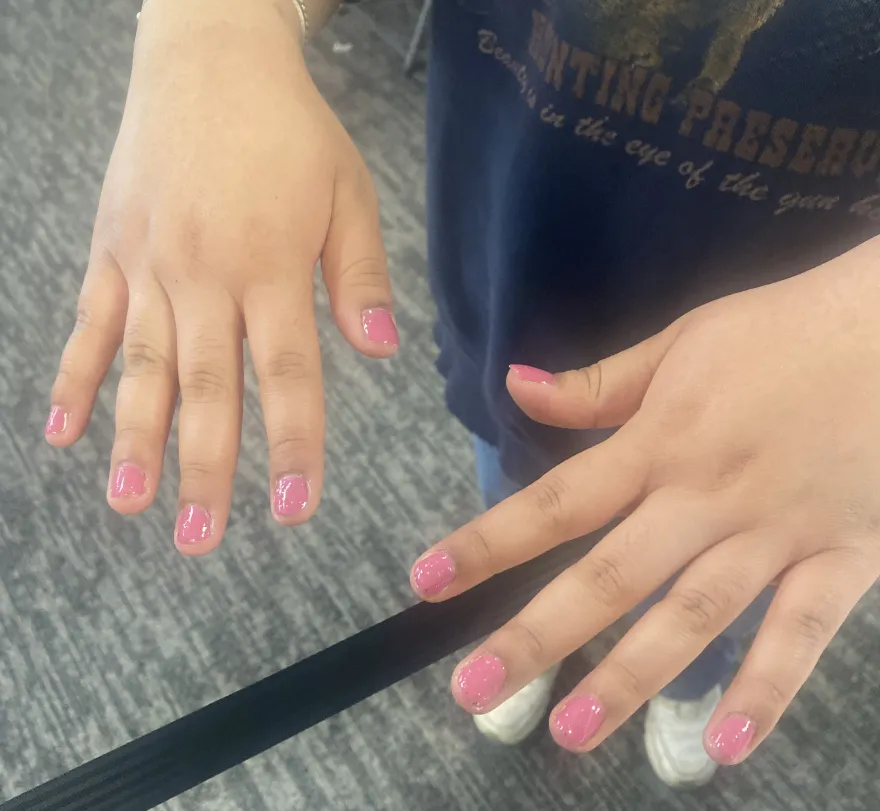 a photo of an NHCC student's hands after getting their nails painted on-campus at our Student Appreciation event.