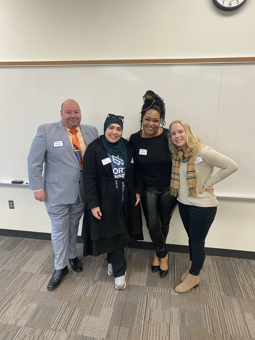 a photo of NHCC President, Rolando, with NHCC students, Muna and Denisha, along with NHCC staff member, Sara at the 2025 Legislative Breakfast event at Saint Paul College. 