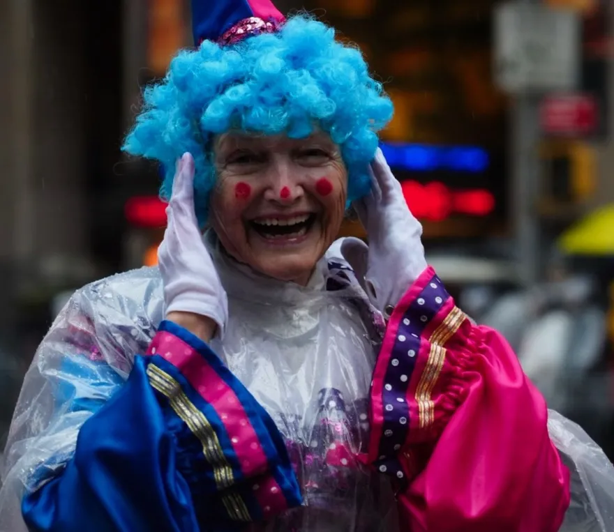 a photo of NHCC education faculty, Susan Moore, dressed in a clown costume as a guest in the 2024 Macy's Thanksgiving Day Parade.