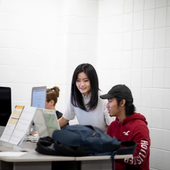 instructor working with student at piano 