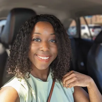 woman smiling in a car